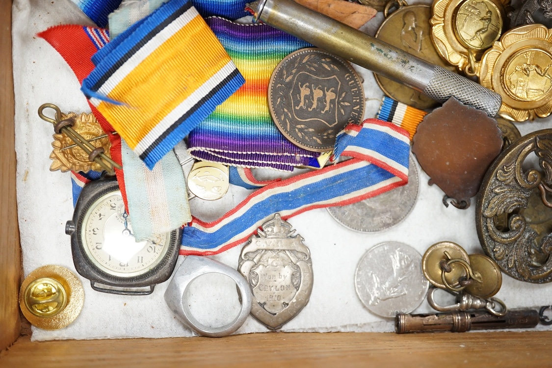 A quantity of assorted medals, an Essex crystal button, badges and ephemera